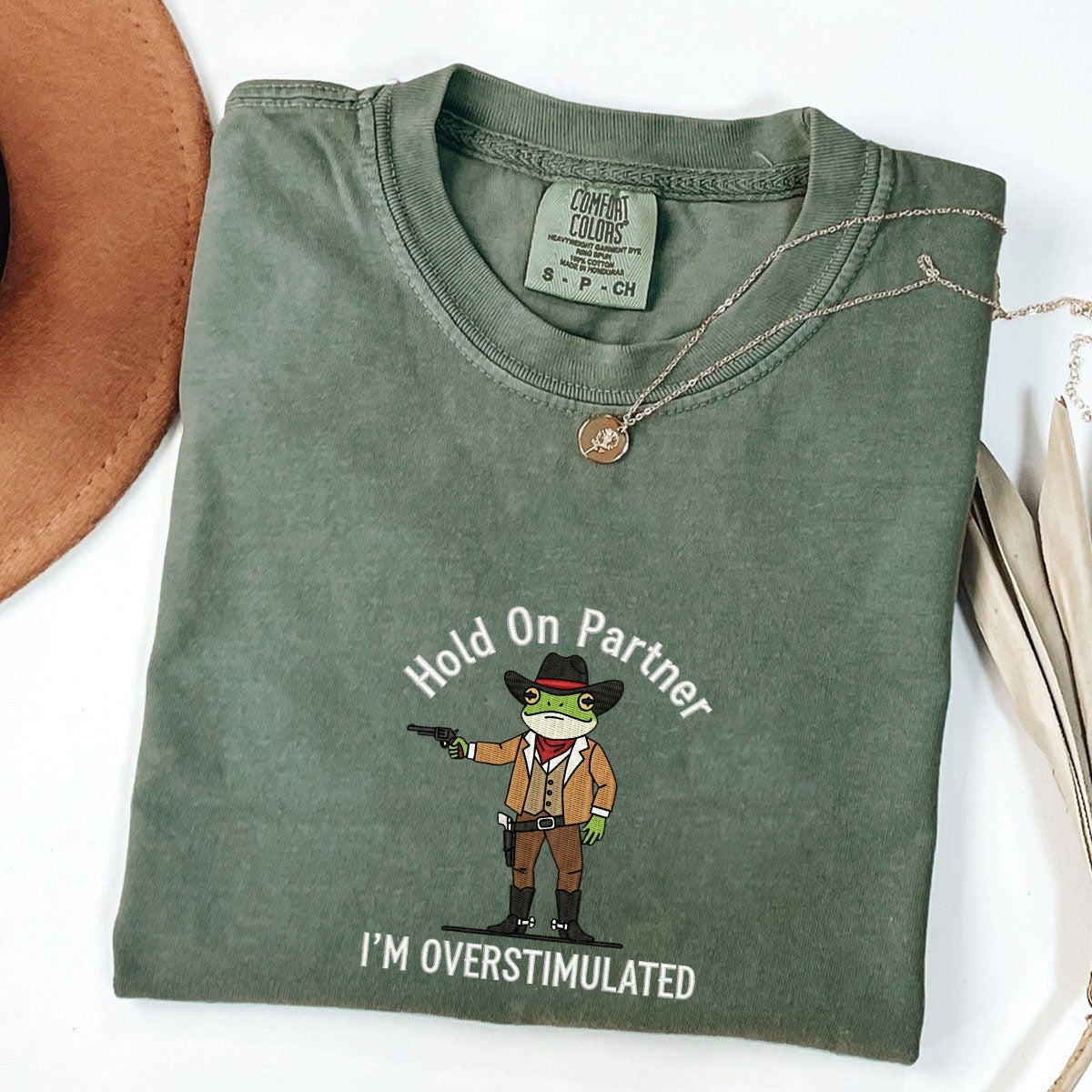 Custom Embroidered Hold On Partner, I’m Overstimulated T-Shirt | Cowboy Frog Meme Tee – Funny Anxiety Shirt Gift