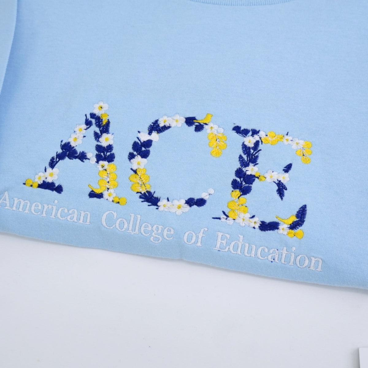 University Custom T-Shirts - Floral Letter Embroidered College Colors - School Spirit Student Gift